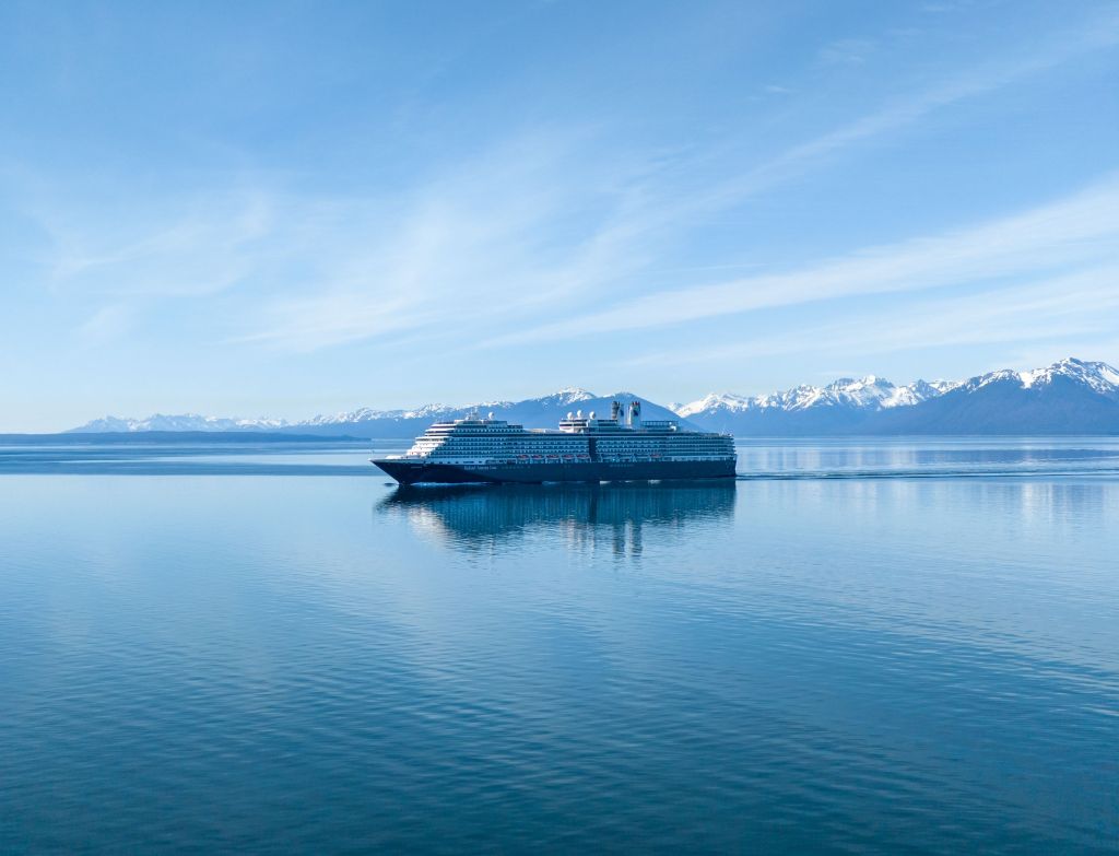 Cruise ship sailing near snowcapped mountains in Hoonah, Alaska